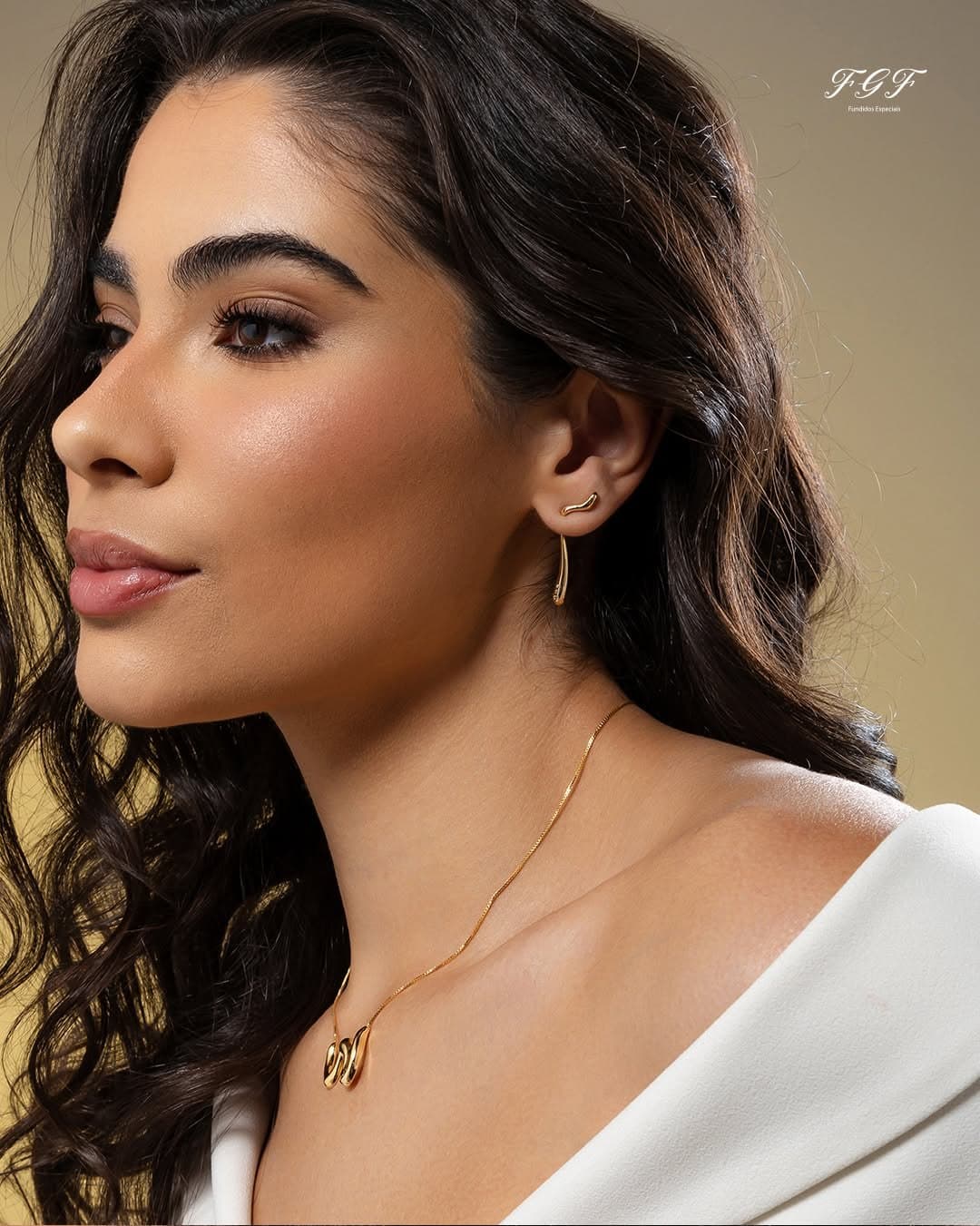 Model wearing an FGF earring and necklace